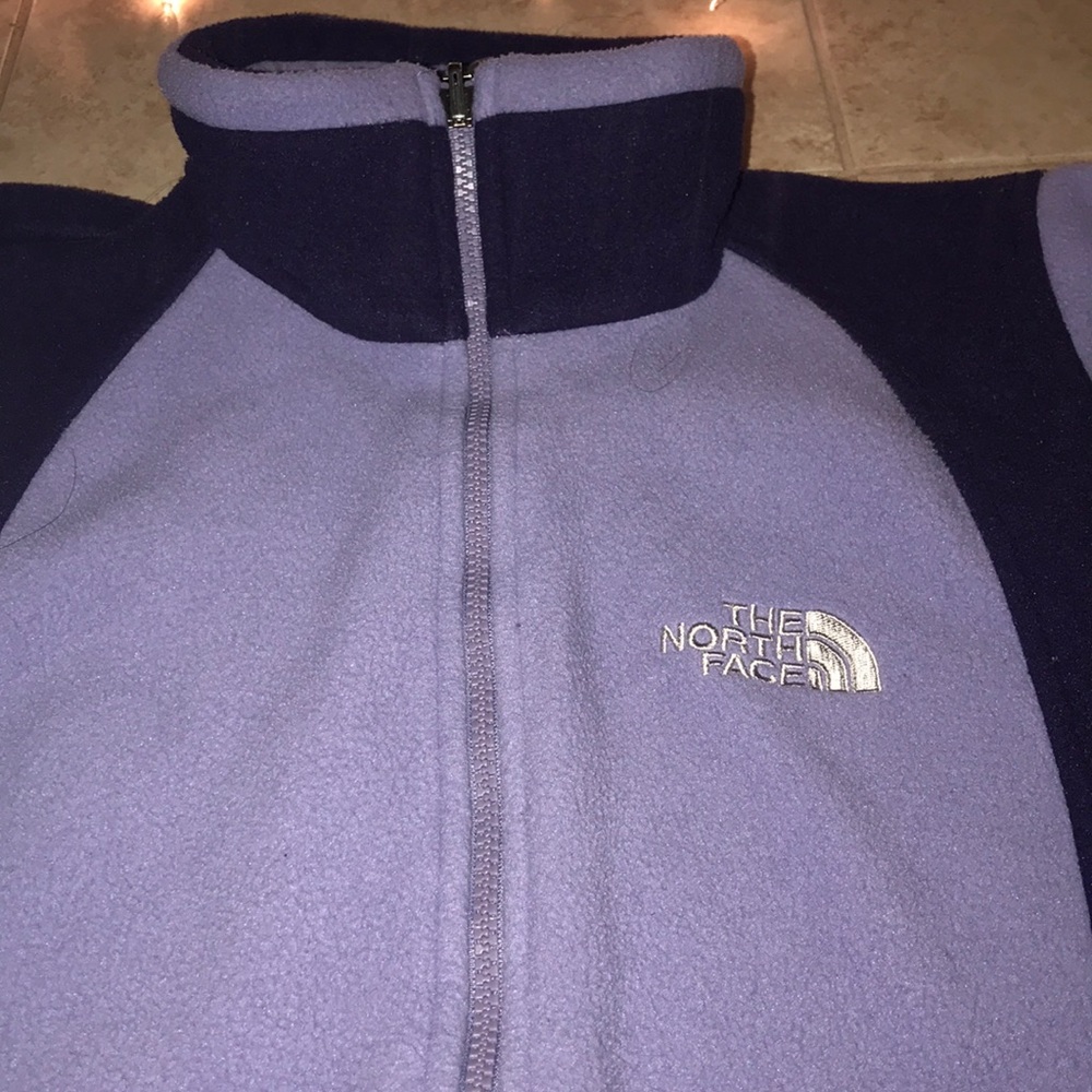 A purple sweater. Size medium.